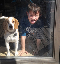 Lilly and Jayden, age 6, keep an eye out for Matt Wilson's return from work.